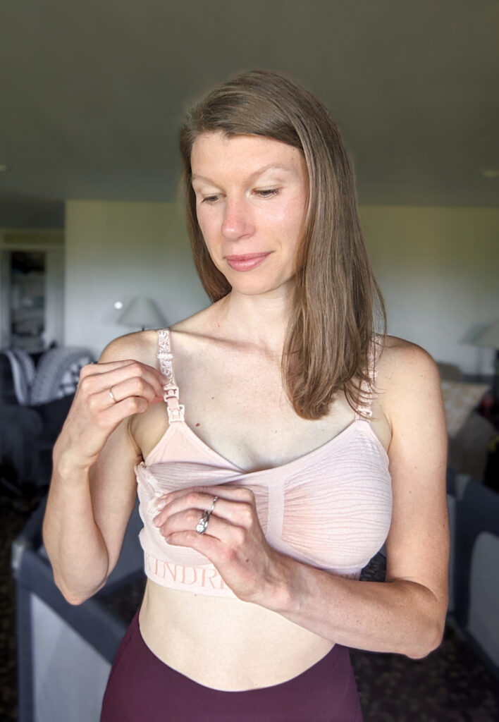 A woman in a kindred bravely pumping and nursing bra