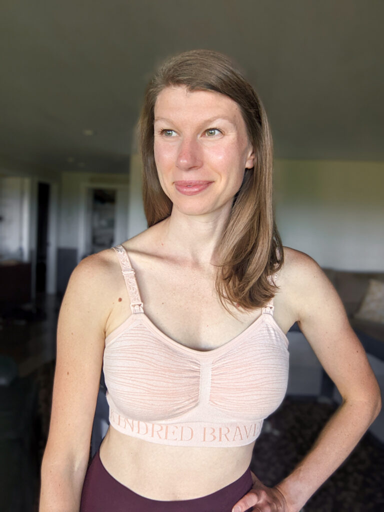 a woman in a kindred bravely pumping and nursing bra
